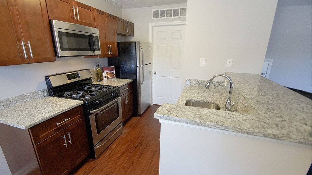 Granite Countertop Kitchen at The Reserves at 1150 Apartments, Integrity Realty LLC, Parma
