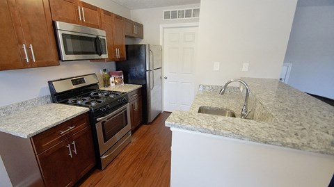 Granite Countertop Kitchen at The Reserves at 1150 Apartments, Integrity Realty LLC, Parma