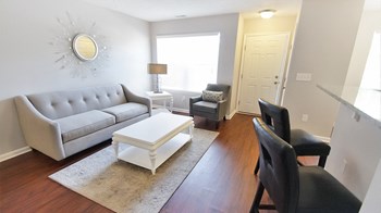 Townhome living room Townhome living room at The Reserves at 1150 Apartments, Integrity Realty LLC, Parma, OH - Photo Gallery 5