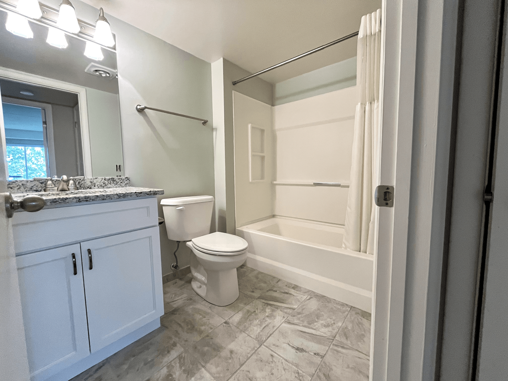 Bathroom with bathtub at Atrium in The Village, Beachwood