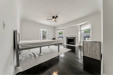Spacious living room with dark hardwood floors at Reserve Overlook* Apartments, Cleveland Heights