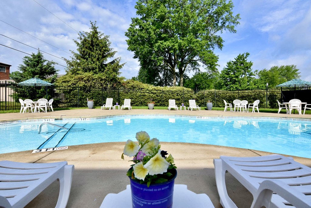 Pool with Lounge Chairs at River Run Apartments in Warren, OH, Integrity Realty LLC