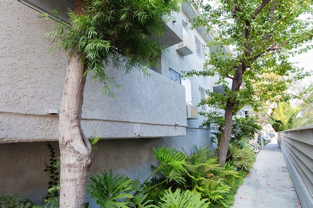 Sideyard of Vinton Apartments with view of balconies.