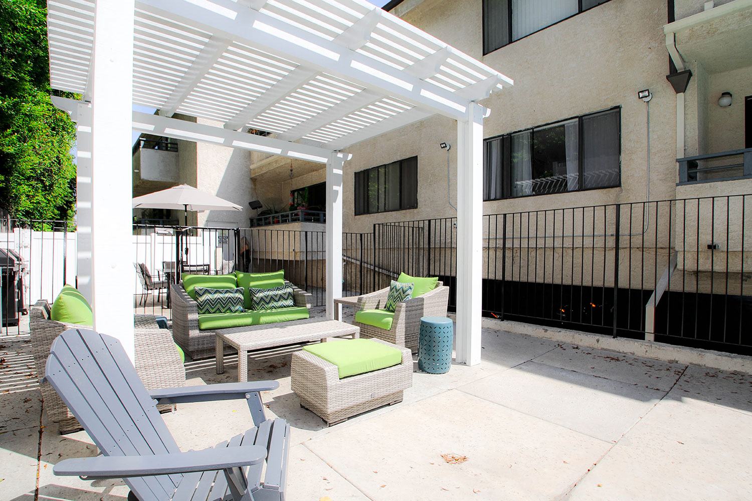 Community barbecue area with seating and lounging space.