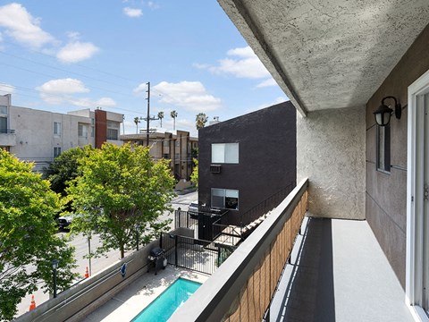 Private balcony overlooking community pool.