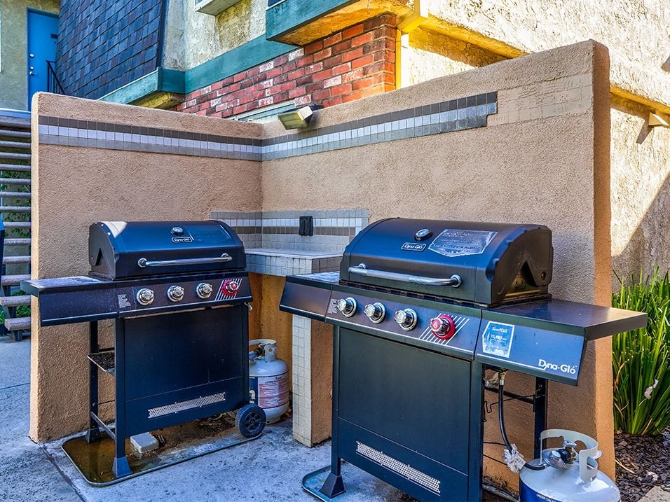 Community barbecue area with two barbeques.