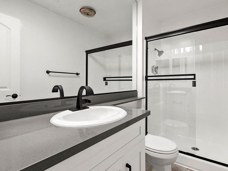 Modern styled bathroom with shower and tub.