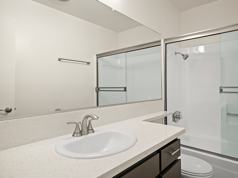 Modern styled bathroom with shower and tub.