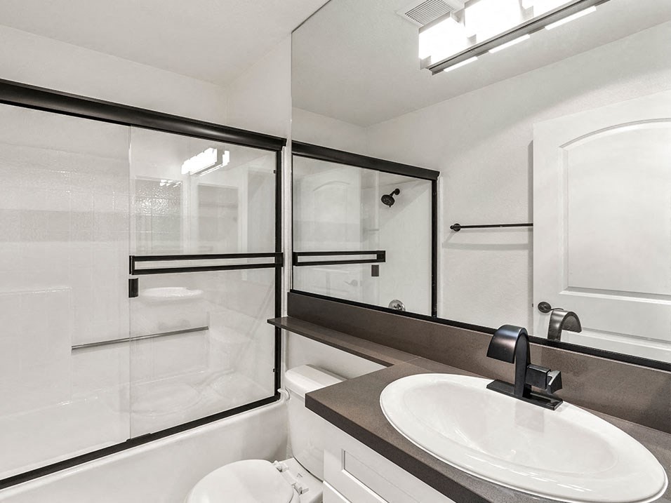 Modern styled bathroom with shower and tub.
