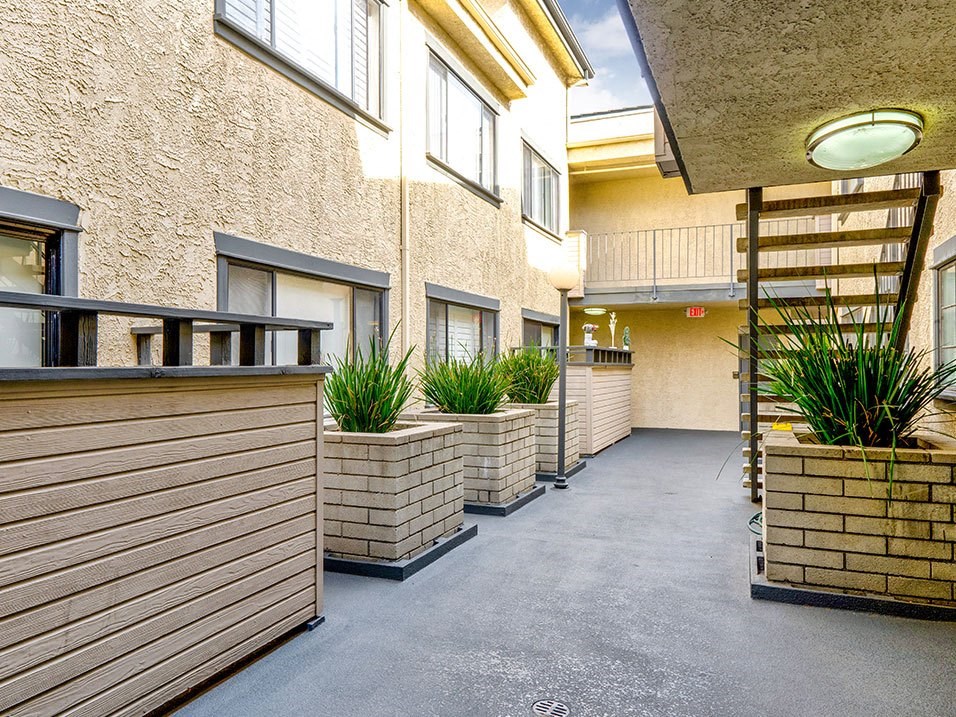 Drought-tolerant greenery and courtyard at Woodridge Apartments.