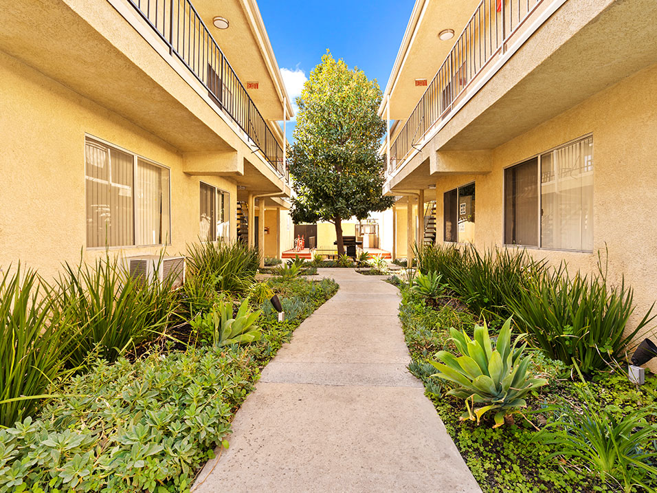 Drought resistant landscaping and barbeques in each courtyard.