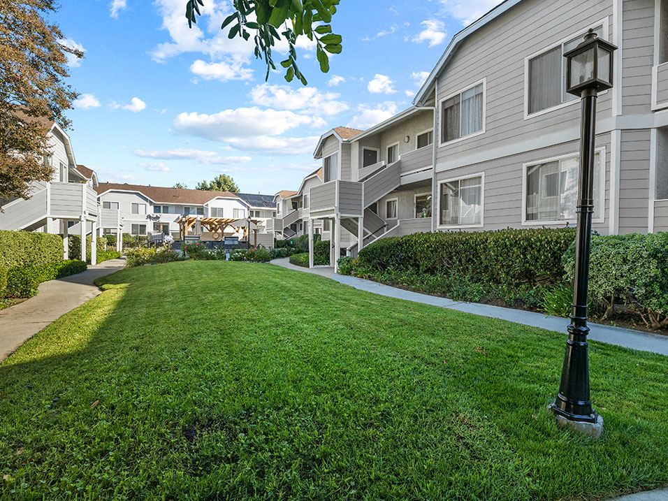 Romantic grass covered courtyard at Corbin Terrace Apartments.