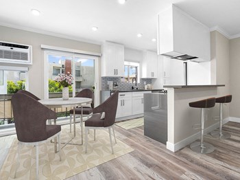 Hardwood floored dining room near bar seating in kitchen. Hardwood floored dining room near bar seating in kitchen. - Photo Gallery 4