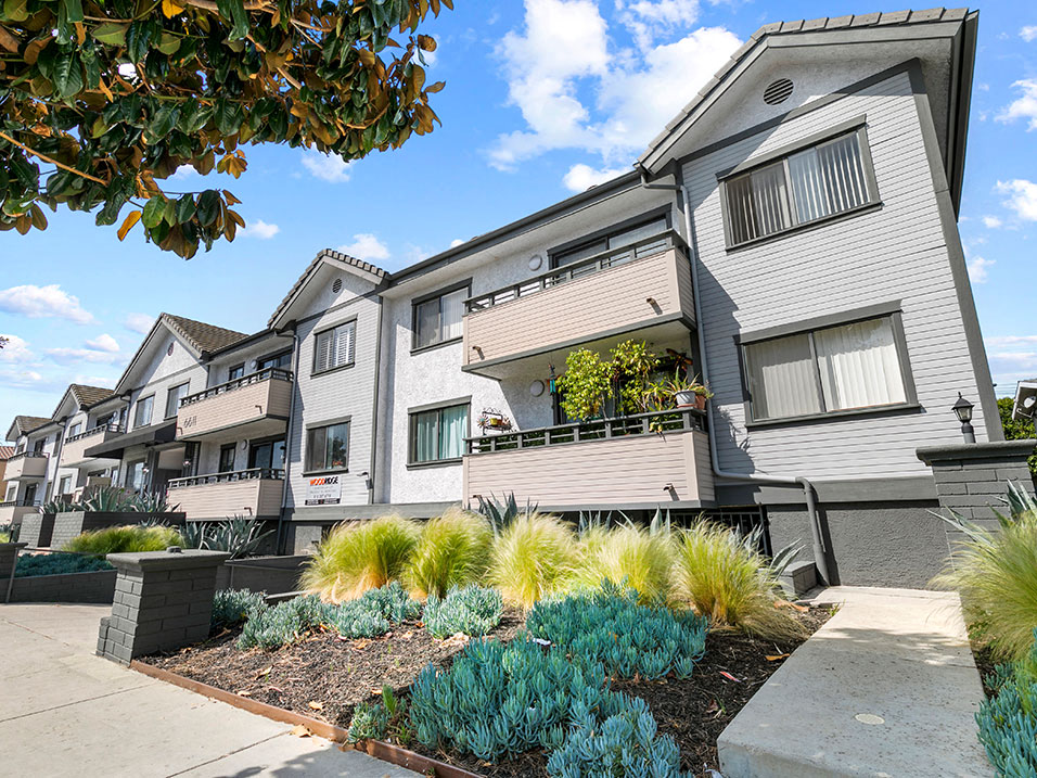 Entrance to Woodridge Apartments with drought tolerant landscape.