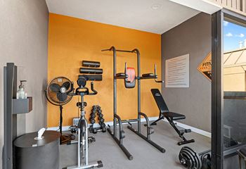 On-site fitness center with weight equipment.