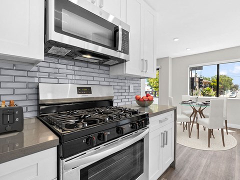 a kitchen with a stove and a microwave