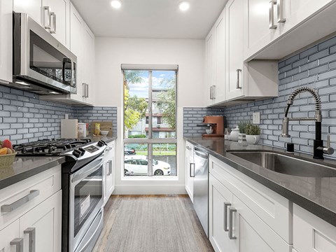 a kitchen with a sink and a window