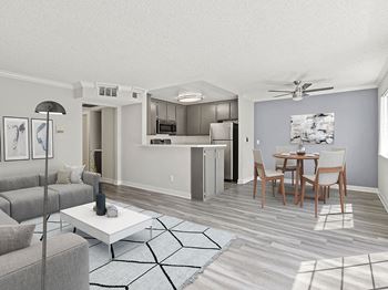 Living room with hardwood floor and view of dining room and kitchen area.