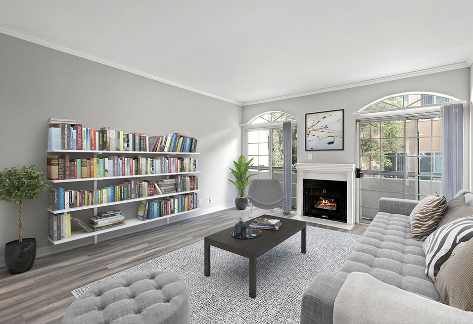 Large living room featuring hardwood floors and natural light providing adjacent patio.
