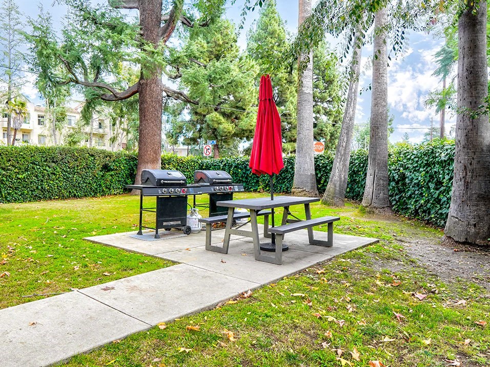 Barbecues and seating area adjacent to the private park.