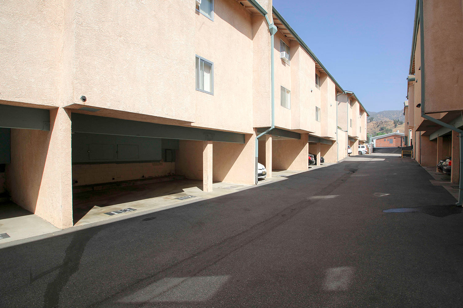 Gated tuck-under parking spots at Olive View Gardens.