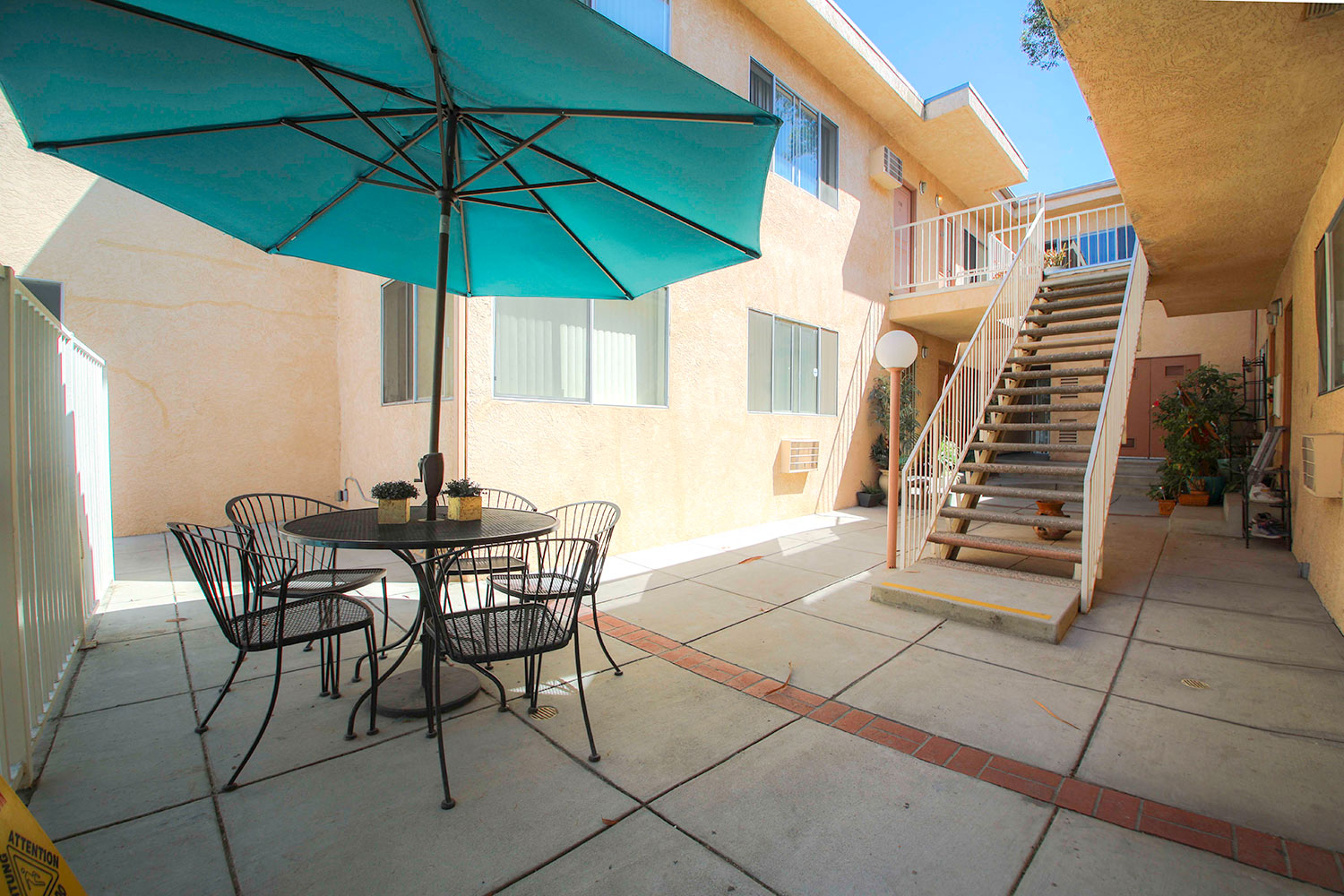 Courtyard picnic space adjacent to solar heated pool.