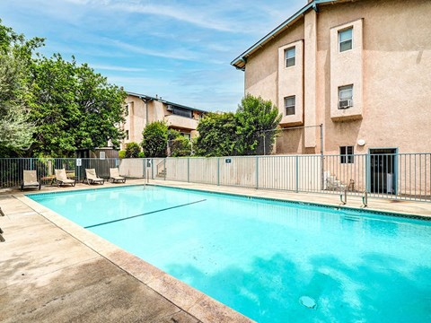 Beautiful community pool with lounging area.