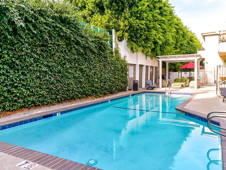 Community pool and lounging area at Woodridge Apartments.