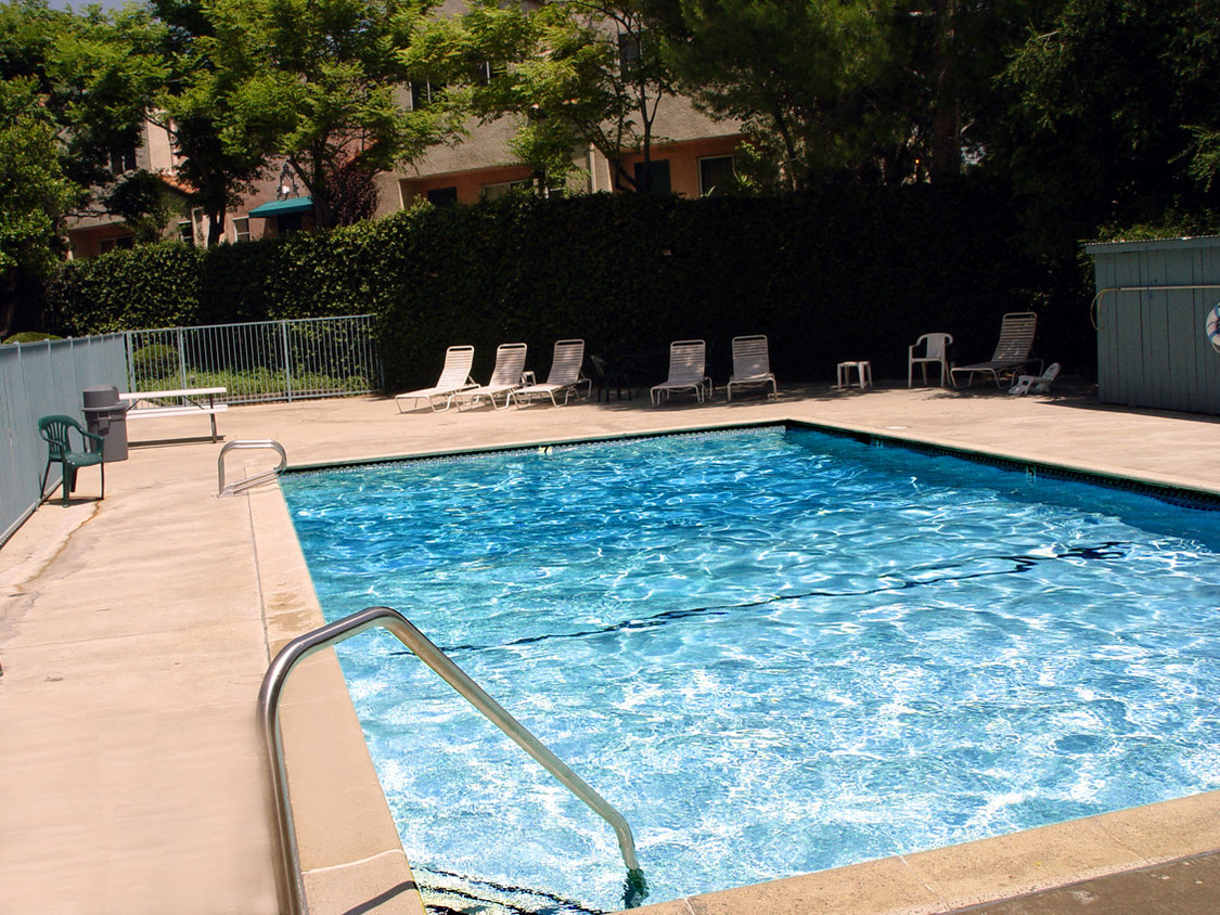 Beautiful community pool with lounging area.