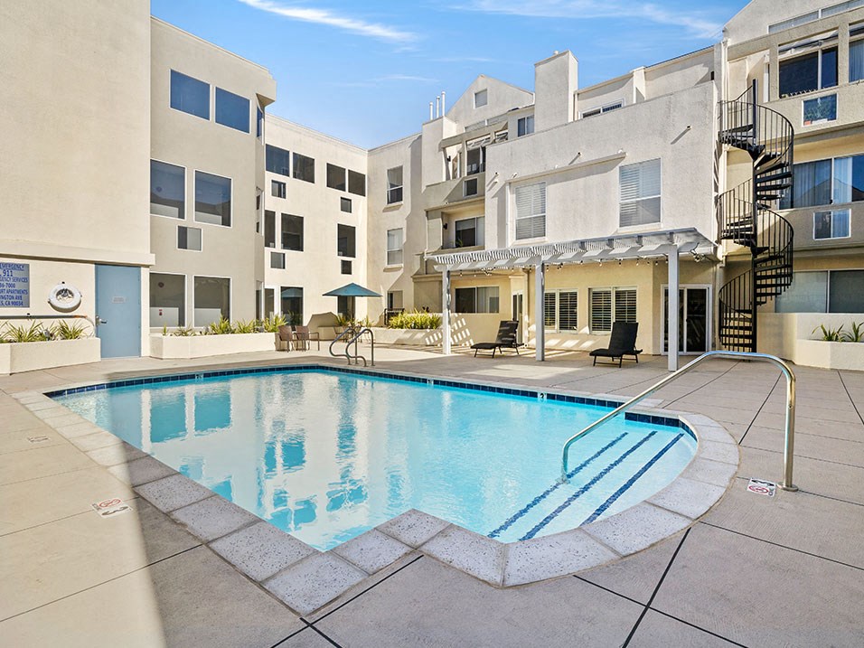 Gorgeous courtyard pool and lounging space at Clarington Court Apartments