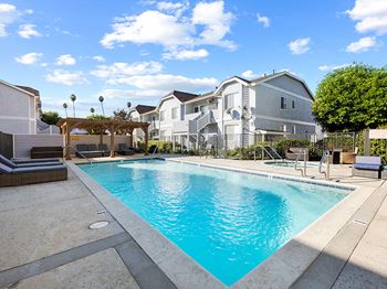 Large courtyard swimming pool, including jacuzzi and lounging area.