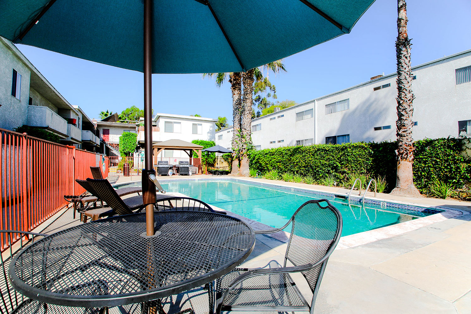 View of shaded pool seating area.
