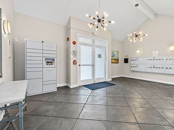 A kitchen with a LUXER brand fridge and a white door.