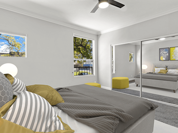 Carpeted bedroom with ceiling fan and mirrored closet. Carpeted bedroom with ceiling fan and mirrored closet. - Photo Gallery 5