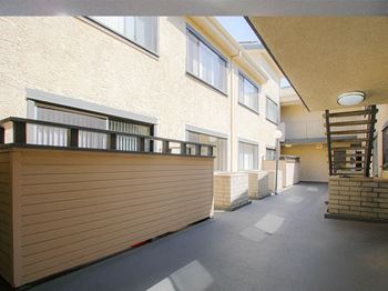 Patios facing courtyard at Woodridge Apartments