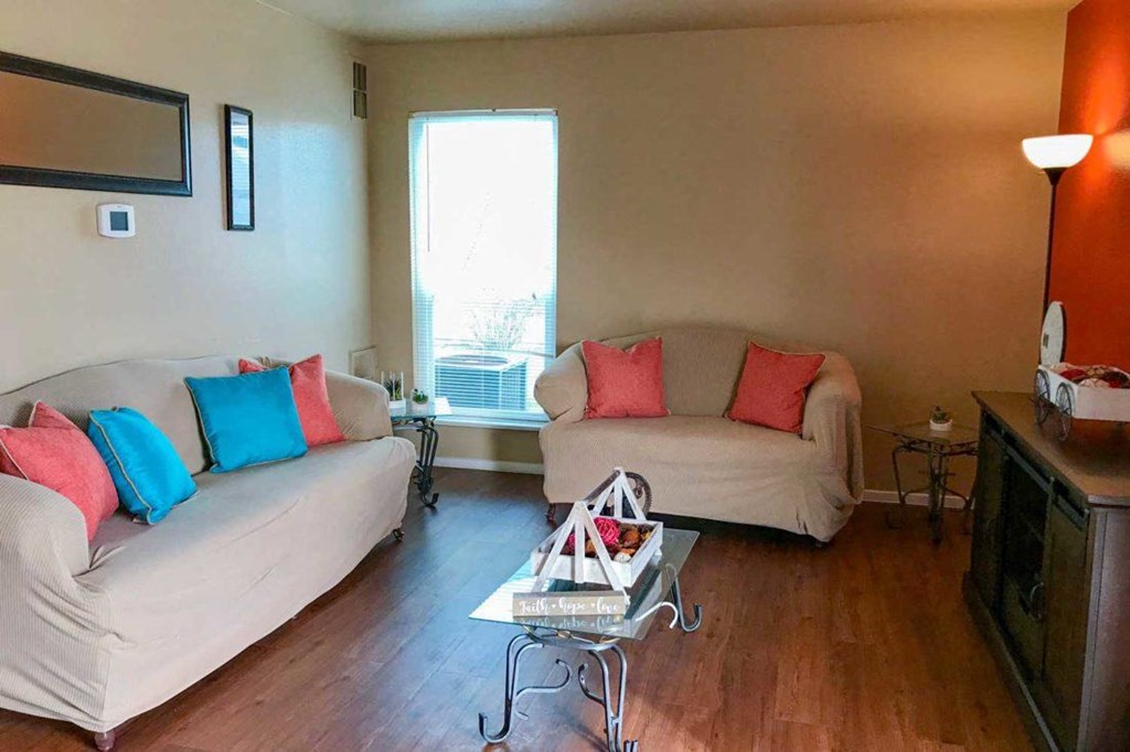 a living room with couches and a table