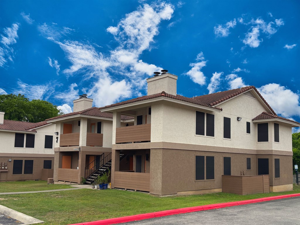 A large building with a red line in front of it.