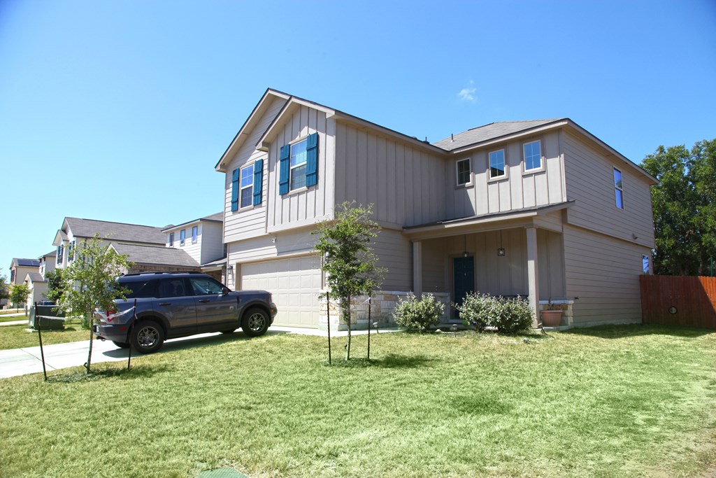a house with a truck parked in front of it