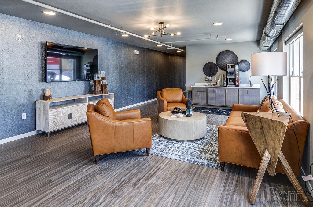 a lobby with couches and chairs and a round table