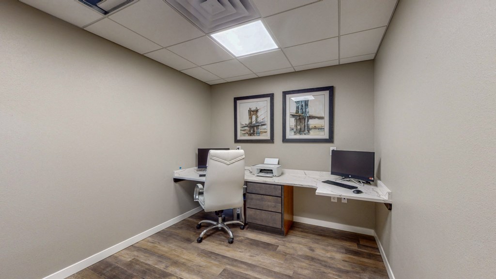 a home office with a desk and a computer