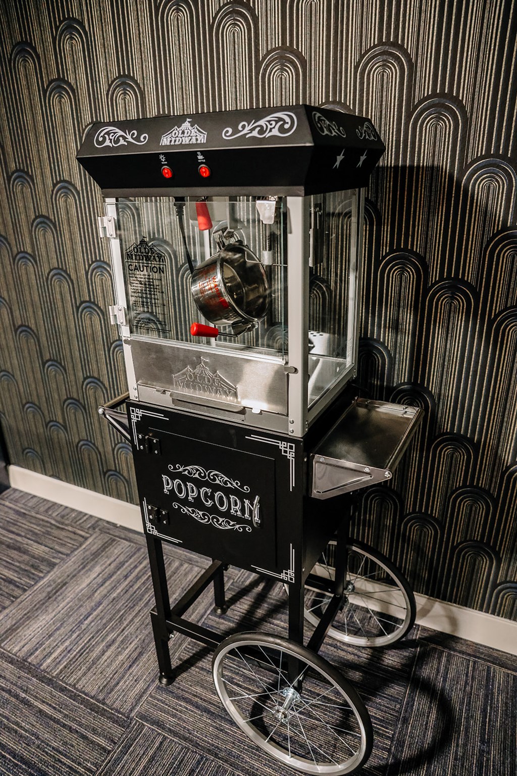 a popcorn machine in the lobby of the popcorn restaurant