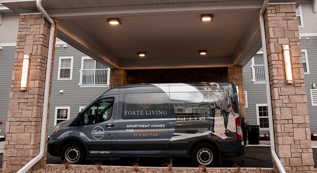 a 2020 parked in front of a building