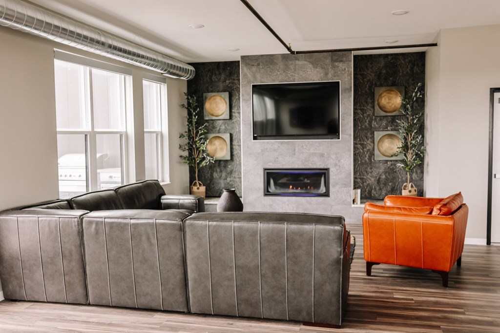 a living room with a couch and a fireplace and a television