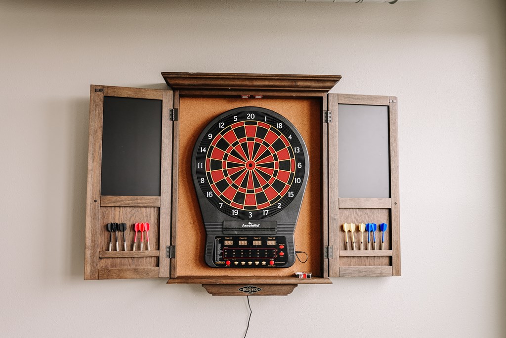 a dart board in a wooden box on a wall