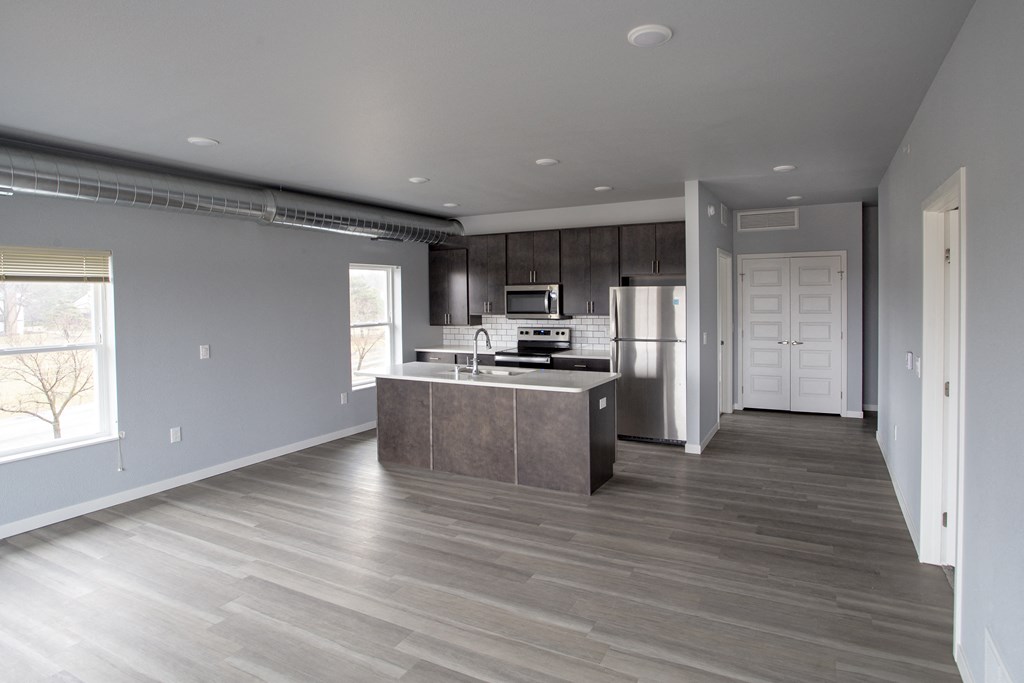 a kitchen with stainless steel appliances in a new home