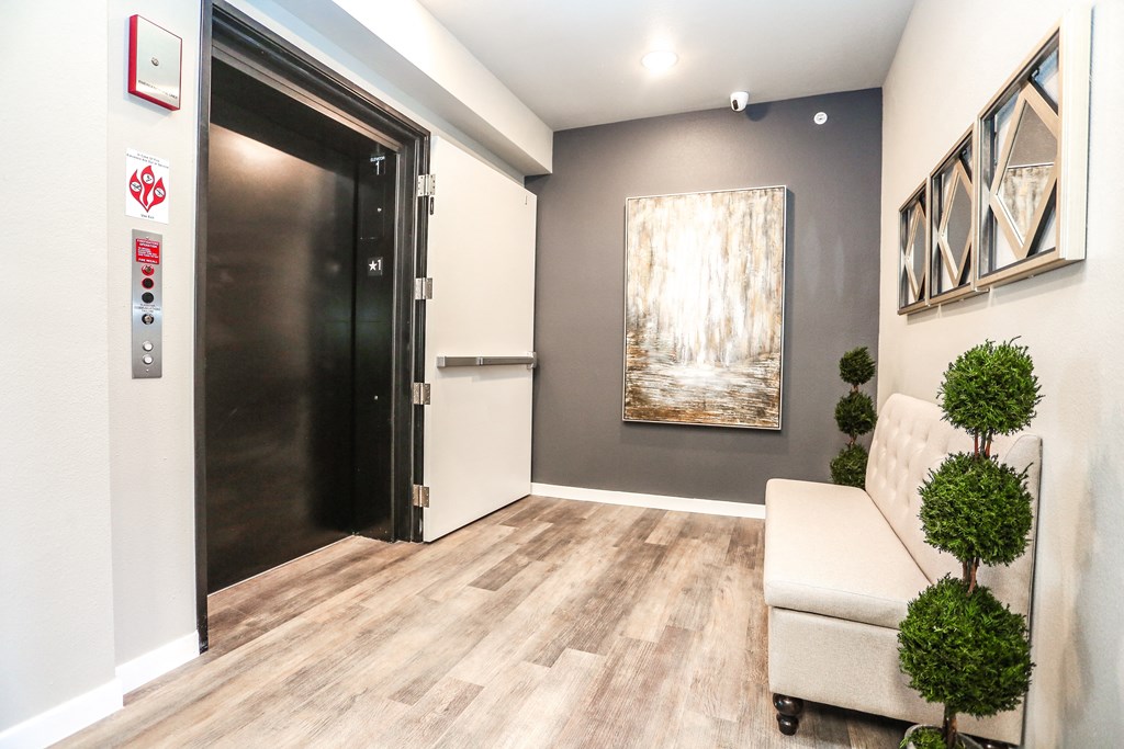 a living room with a black door and a white couch
