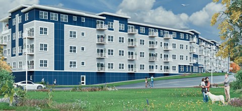 A large apartment building with a blue and white exterior.
