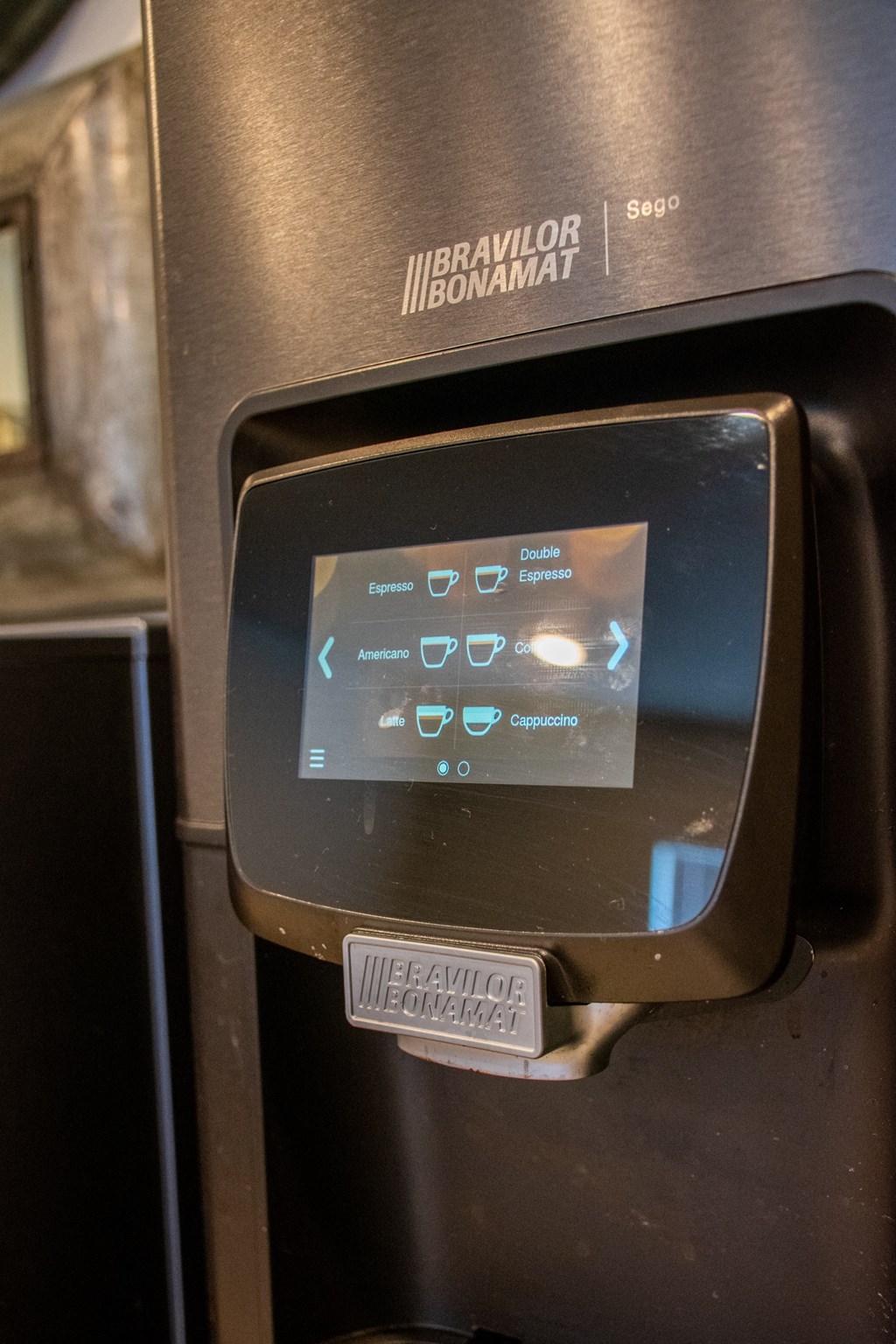 a close up of a parking meter with a sticker on it