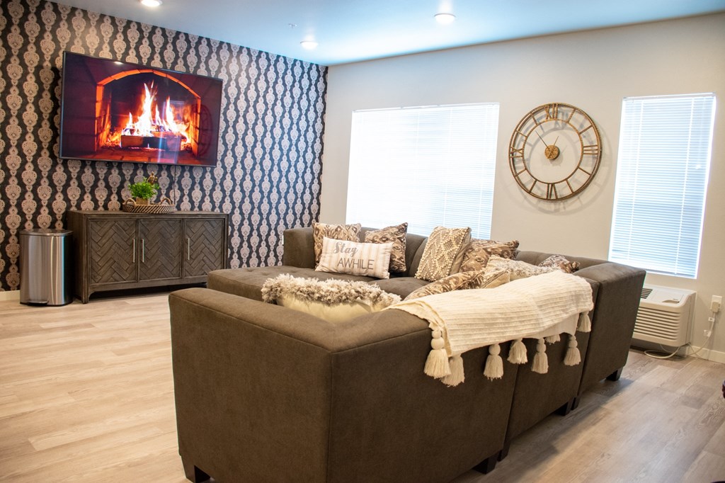 a living room with a couch and a fireplace