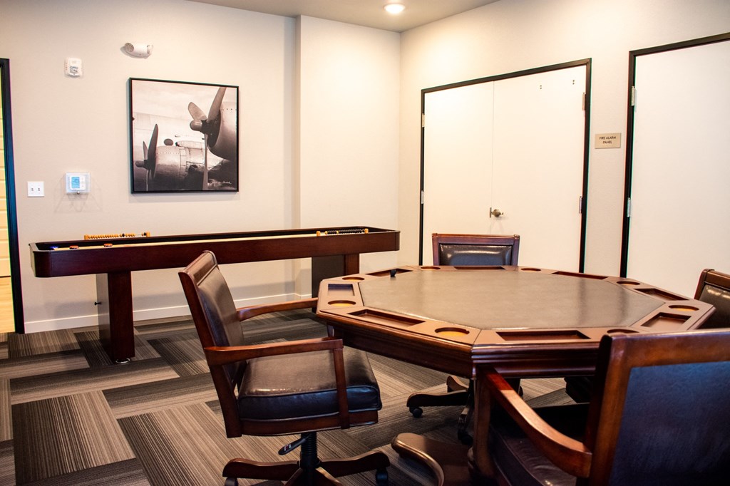 a game room with a pool table and a ping pong table